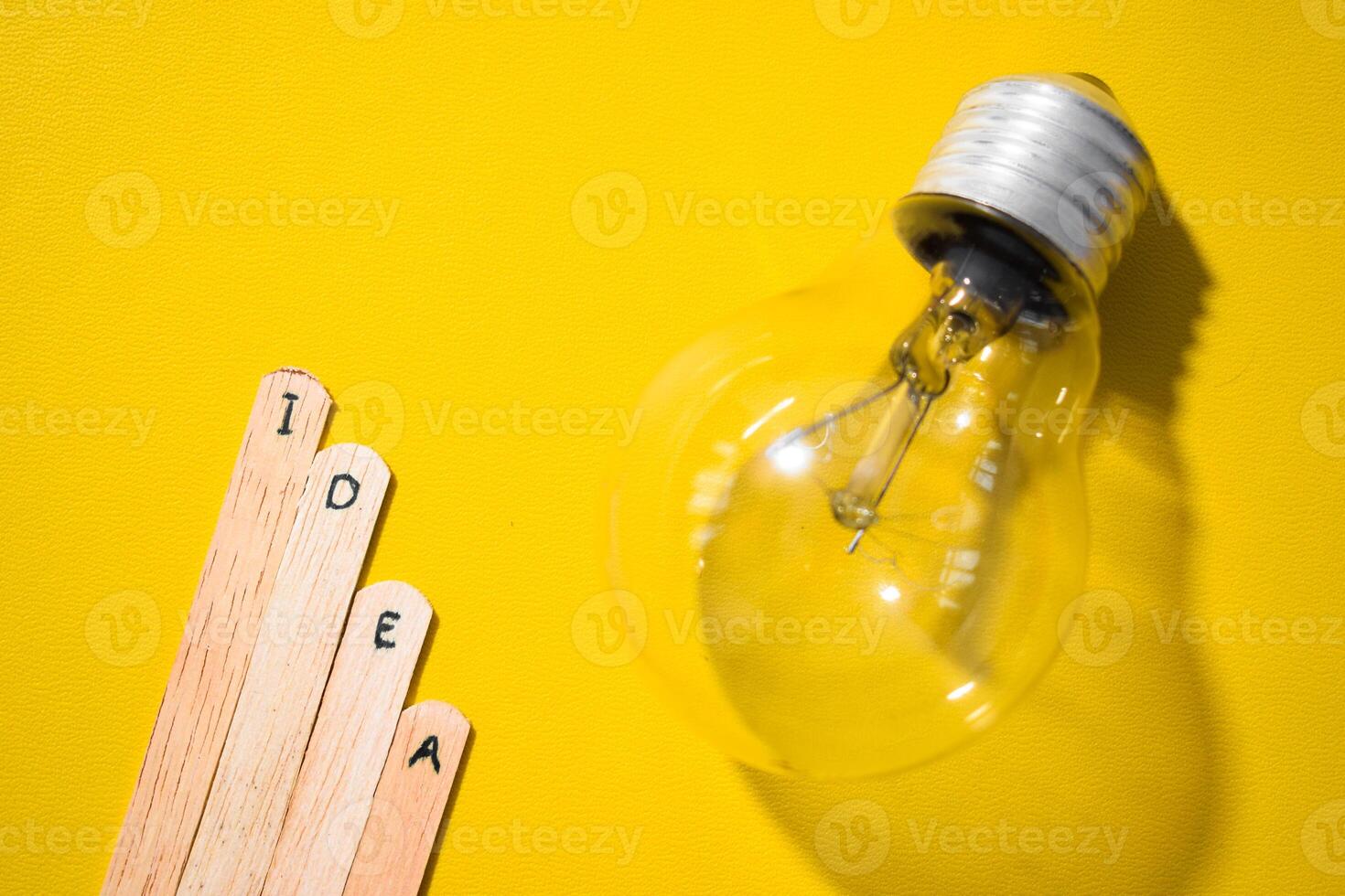 stick of ice cream with the words Idea and lightbulb. Motivational quotes, optimism, positive words. Isolated on background photo