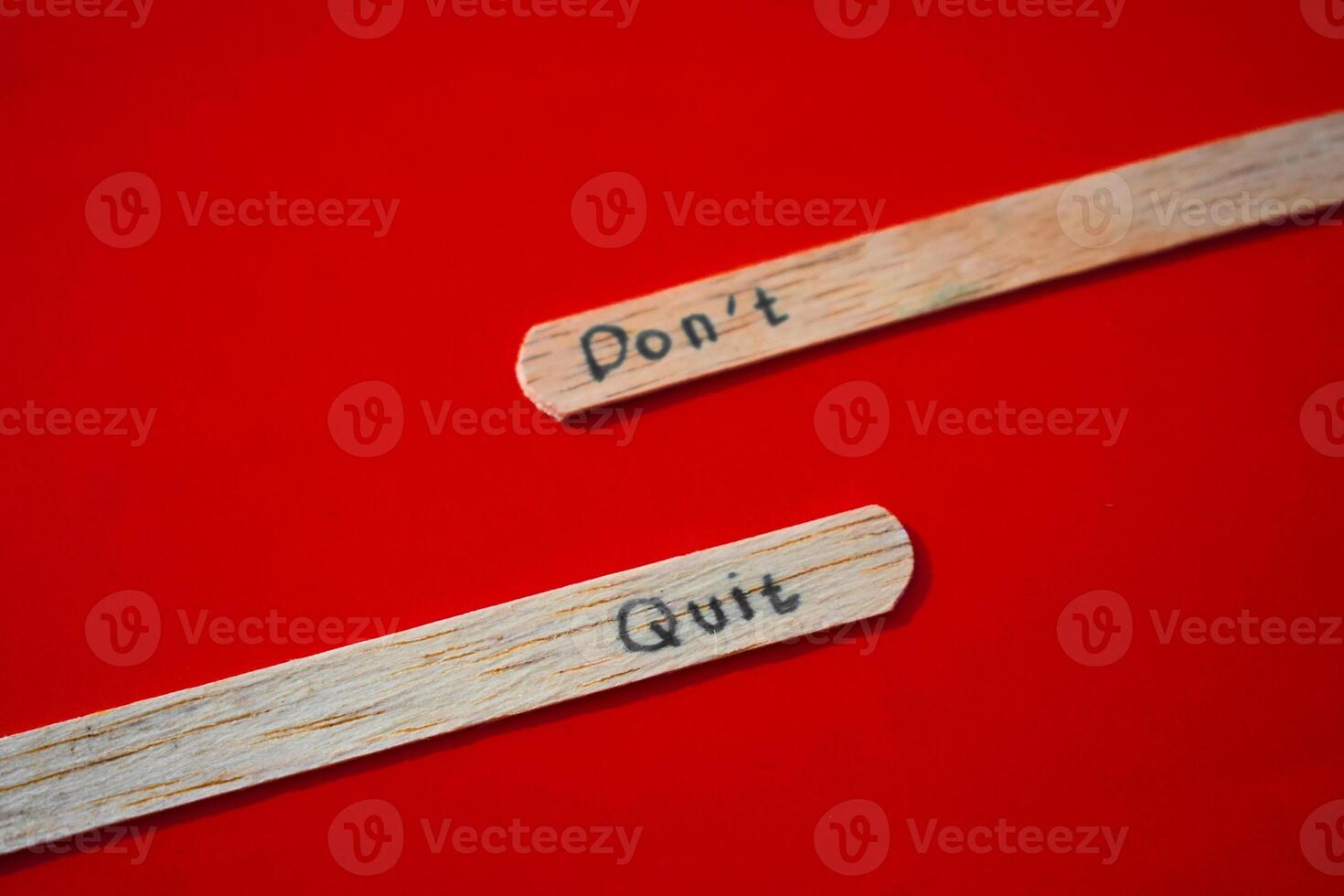stick of ice cream with the words Don't quit. Motivational quotes, optimism, positive words. Isolated on background photo