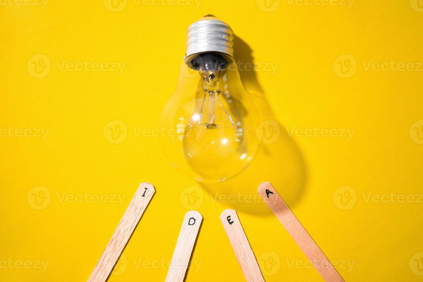 stick of ice cream with the words Idea and lightbulb. Motivational quotes, optimism, positive words. Isolated on background photo