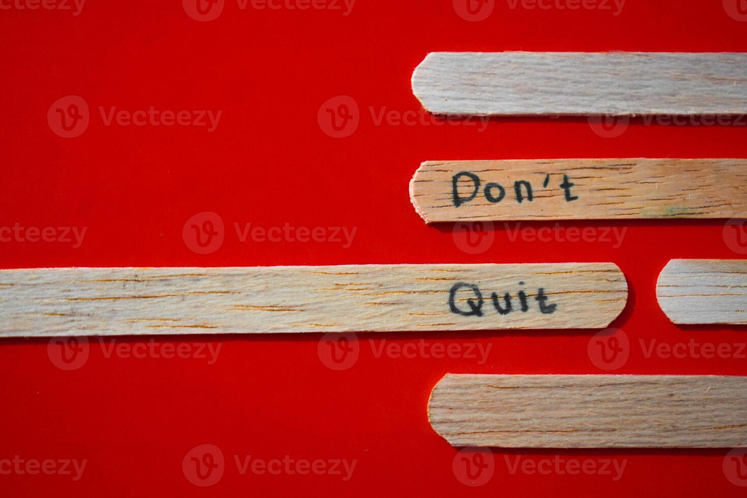 stick of ice cream with the words Don't quit. Motivational quotes, optimism, positive words. Isolated on background photo