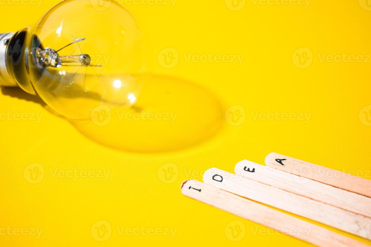 stick of ice cream with the words Idea and lightbulb. Motivational quotes, optimism, positive words. Isolated on background photo