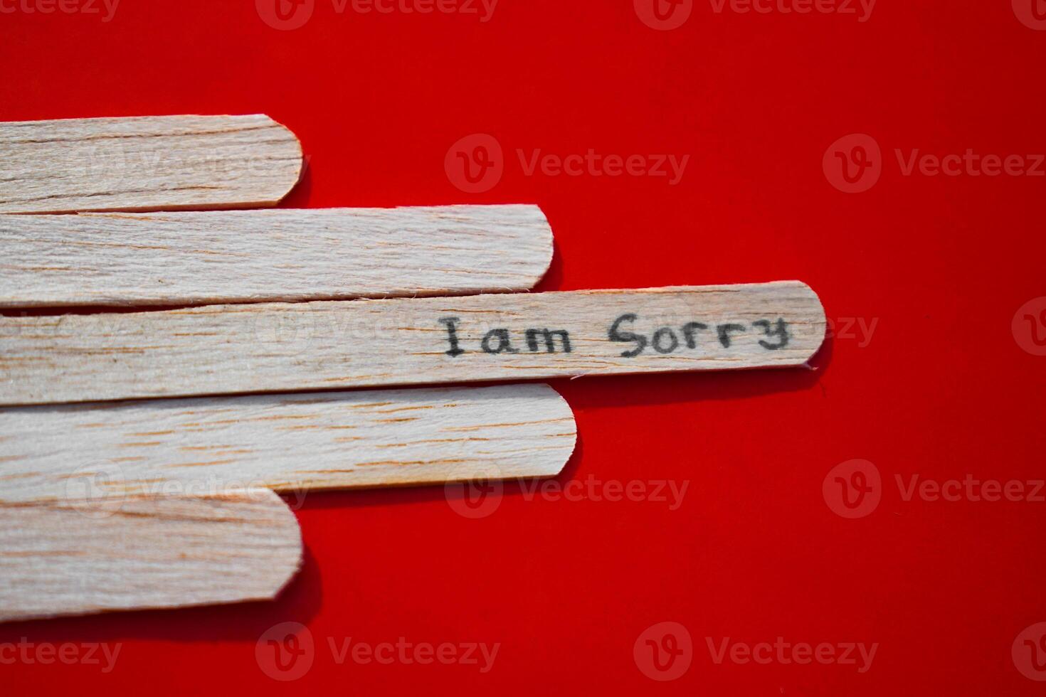stick of ice cream with the words I am sorry. Motivational quotes, optimism, positive words. Isolated on background photo