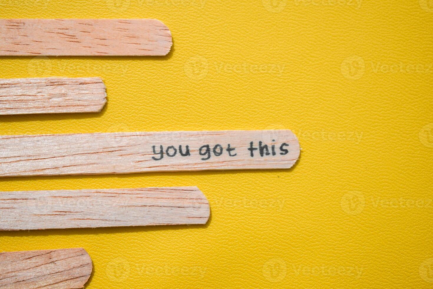 stick of ice cream with the words you got this. Motivational quotes, optimism, positive words. Isolated on background photo
