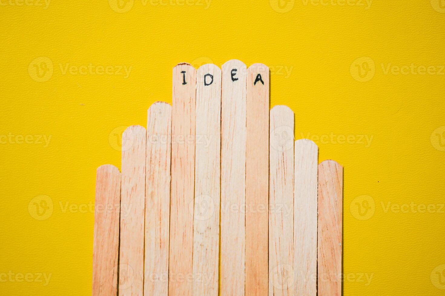 stick of ice cream with the words Idea. Motivational quotes, optimism, positive words. Isolated on background photo