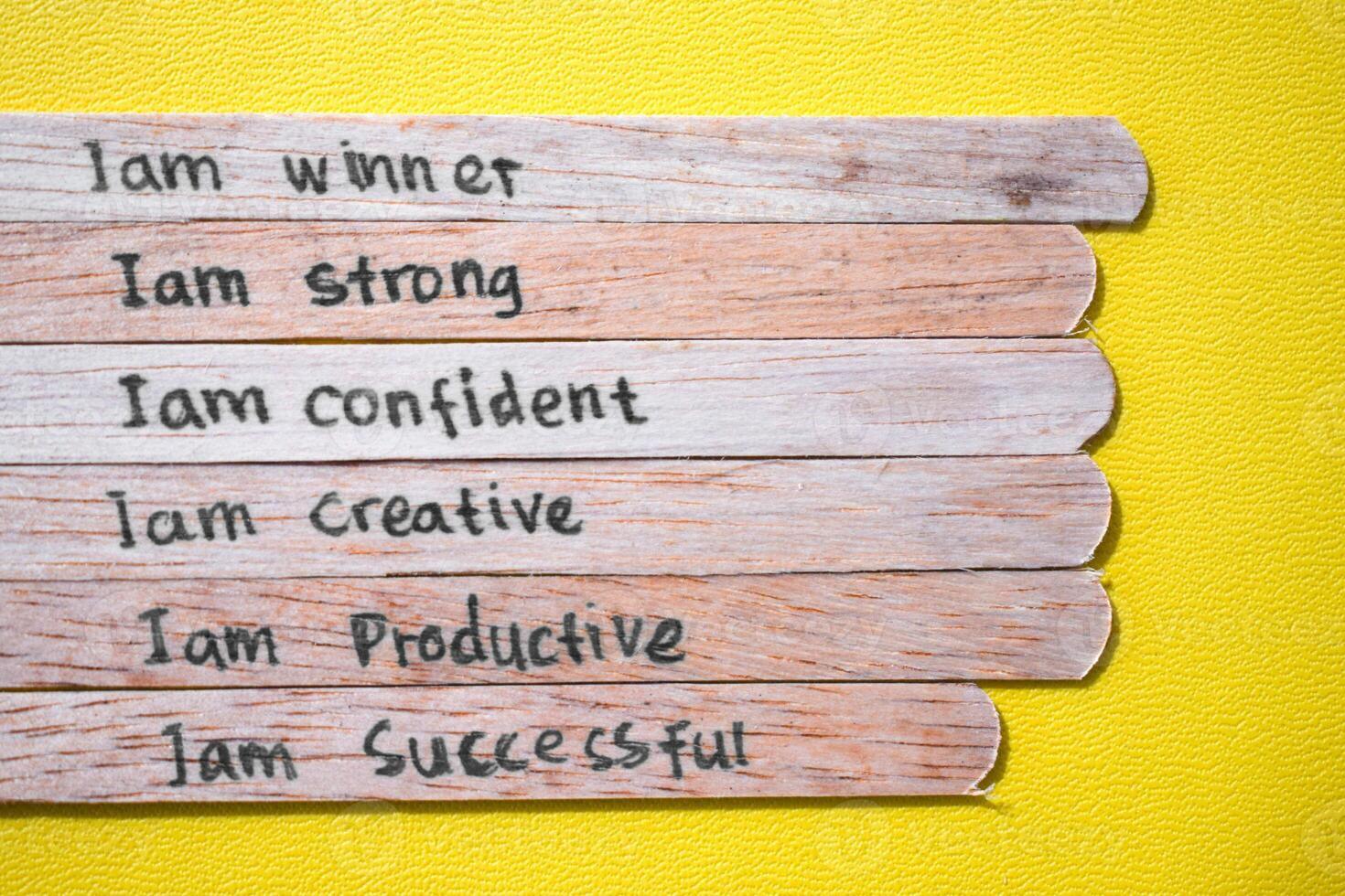 stick of ice cream with the words I am winner, strong, confident, creative, productive, successful. Motivational quotes, optimism, positive words photo
