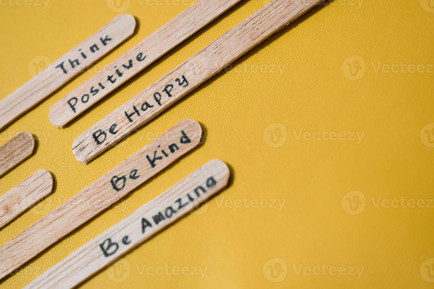 stick of ice cream with the words Think Positive, Be happy, Be Kind, Be Amazing. Motivational quotes, optimism, positive words. Isolated on background photo