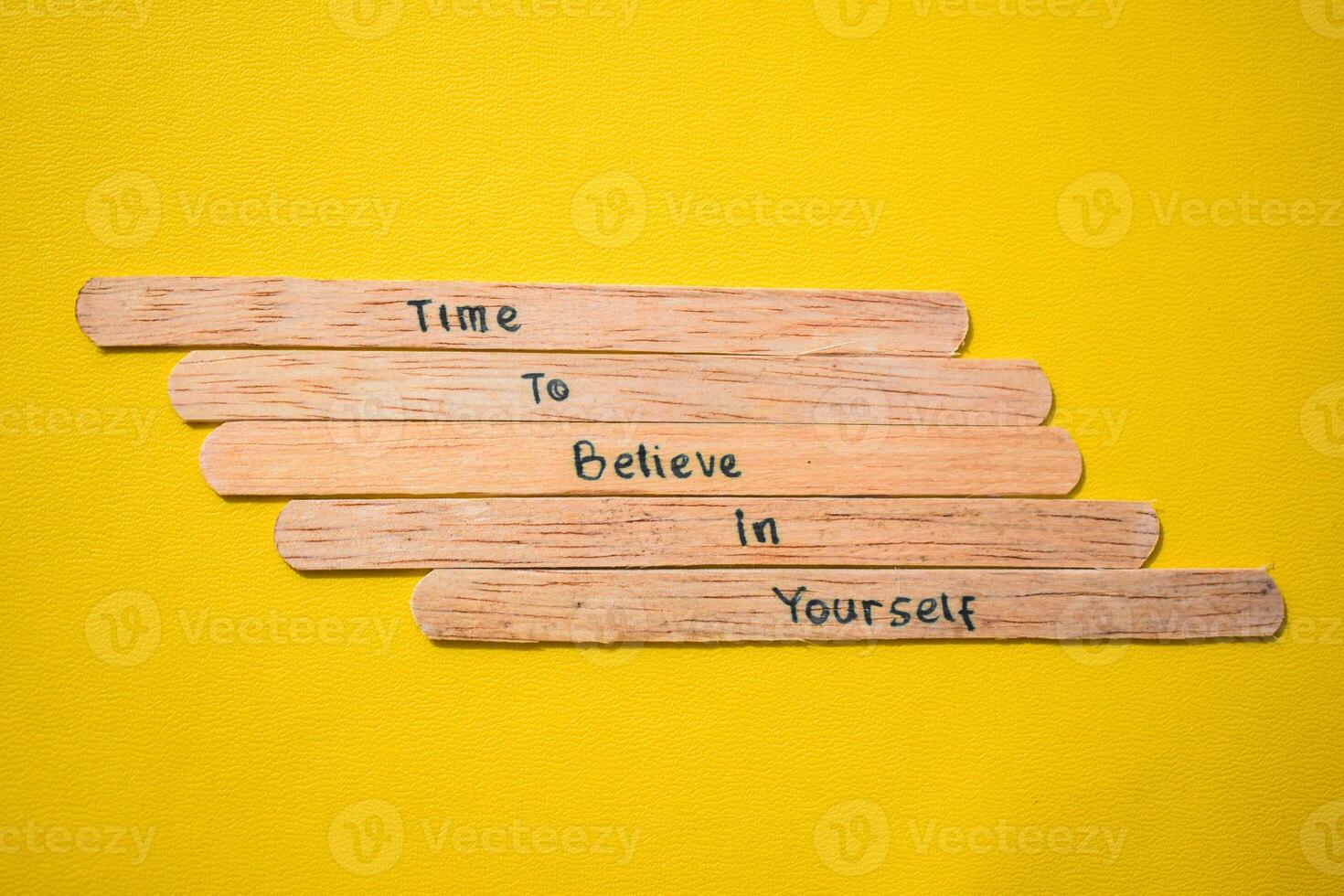 stick of ice cream with the words time to believe in yourself. Motivational quotes, optimism, positive words. Isolated on background photo