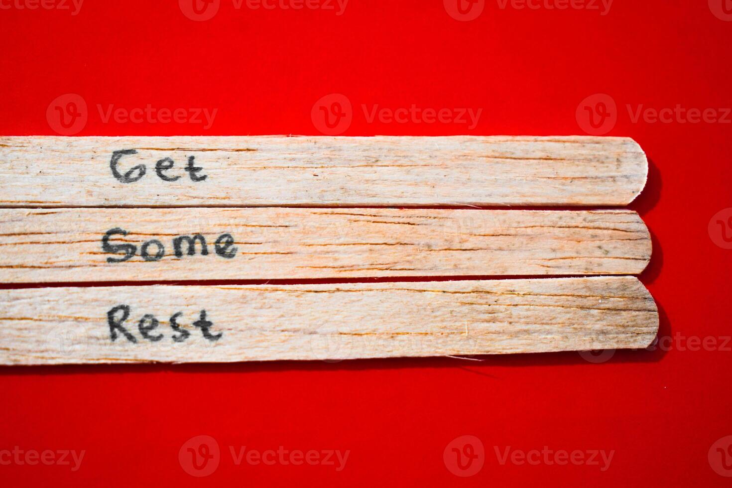 stick of ice cream with the words Get Some Rest. Motivational quotes, optimism, positive words. Isolated on background photo