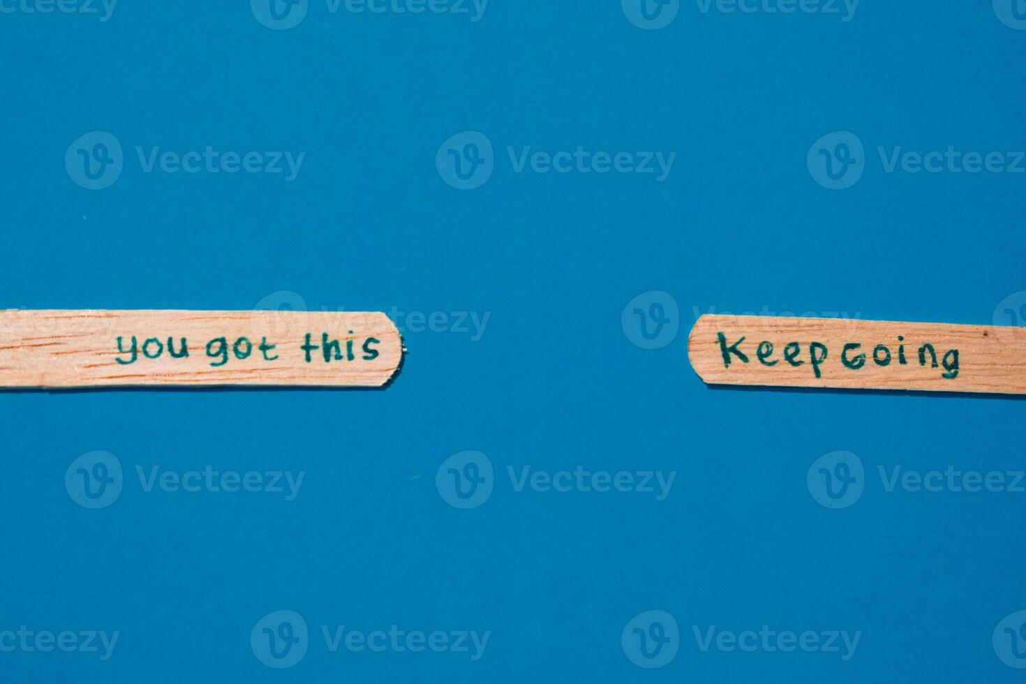 stick of ice cream with the words you got this and keep going. Motivational quotes, optimism, positive words. Isolated on background photo