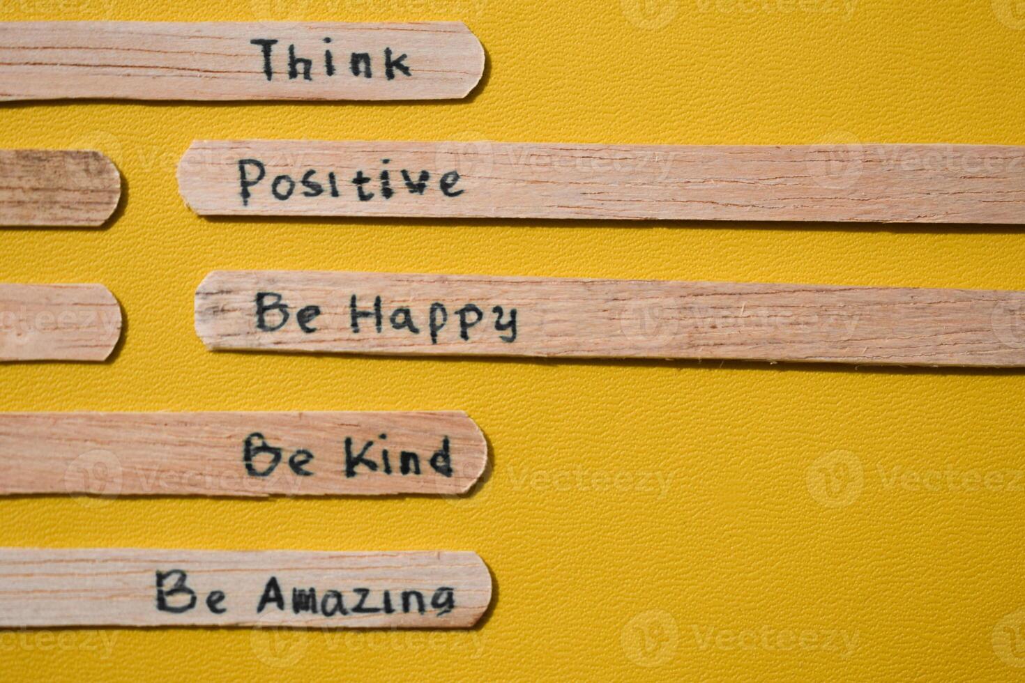 stick of ice cream with the words Think Positive, Be happy, Be Kind, Be Amazing. Motivational quotes, optimism, positive words. Isolated on background photo
