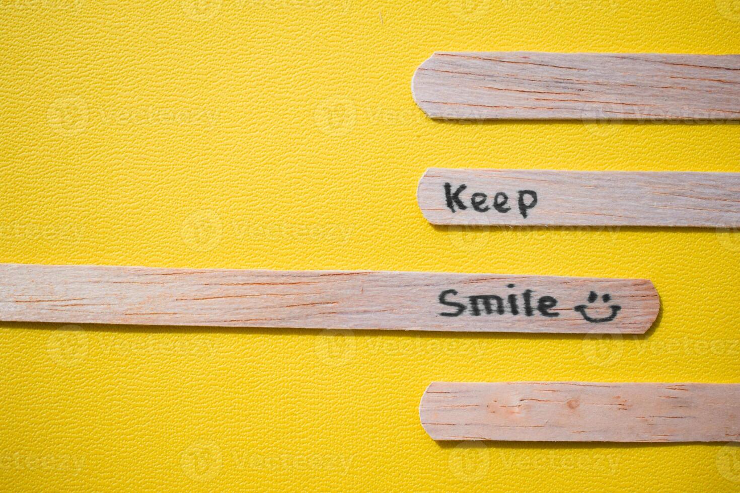 stick of ice cream with the words Keep Smile. Motivational quotes, optimism, positive words. Isolated on background photo