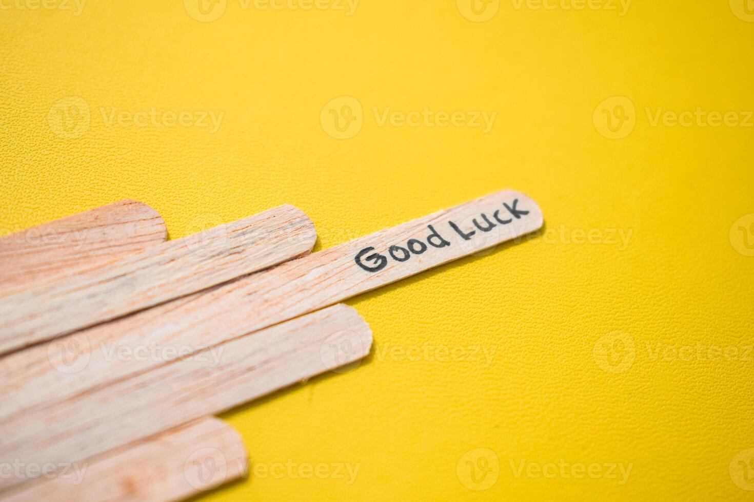 stick of ice cream with the words good luck. Motivational quotes, optimism, positive words. Isolated on background photo