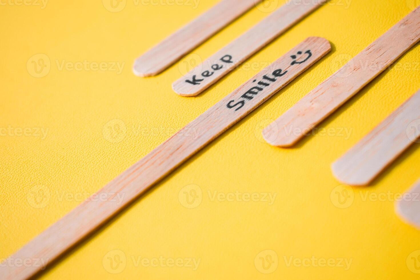 stick of ice cream with the words Keep Smile. Motivational quotes, optimism, positive words. Isolated on background photo