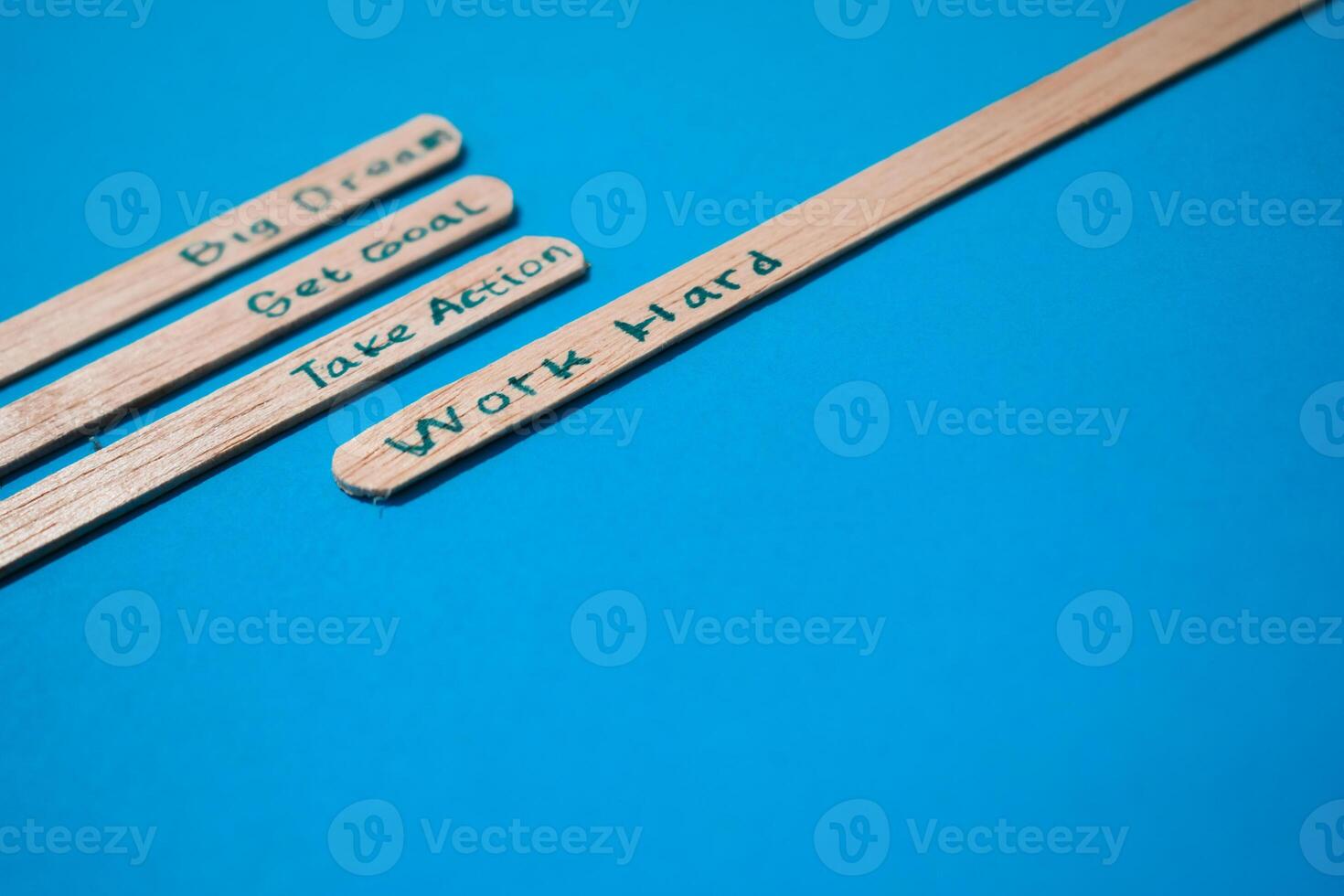 stick of ice cream with the words Big dream, Get goal, Take action, Work hard. Motivational quotes, optimism, positive words. Isolated on background photo