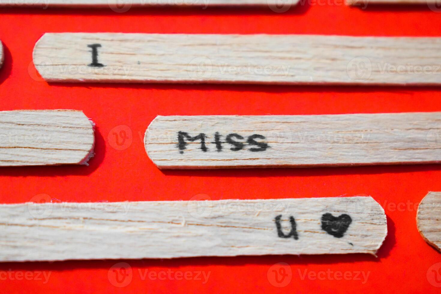 stick of ice cream with the words I Miss You. Romance quotes, optimism, positive words. Isolated on background photo
