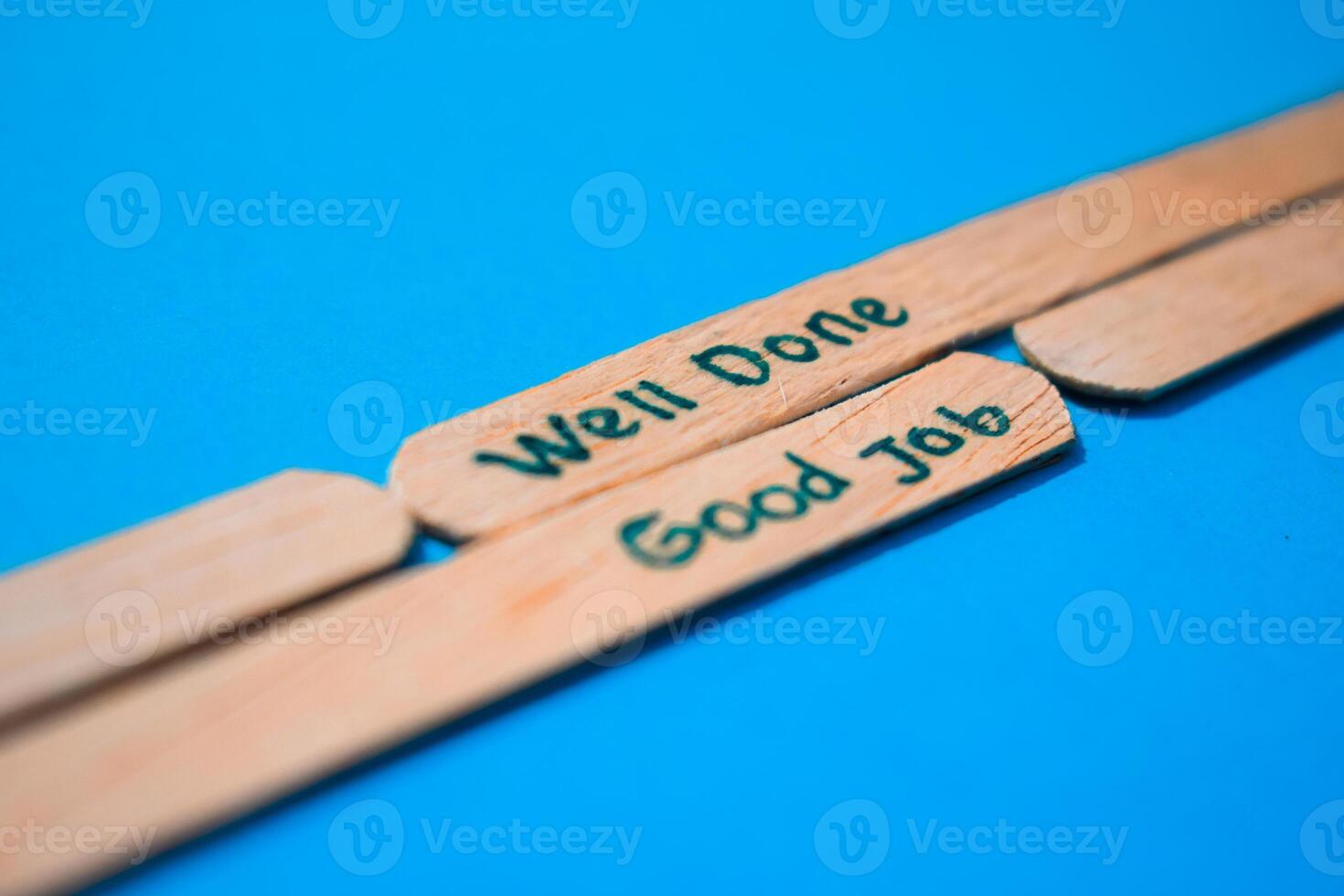 stick of ice cream with the words Well done and Good Job. Motivational quotes, optimism, positive words. Isolated on background photo