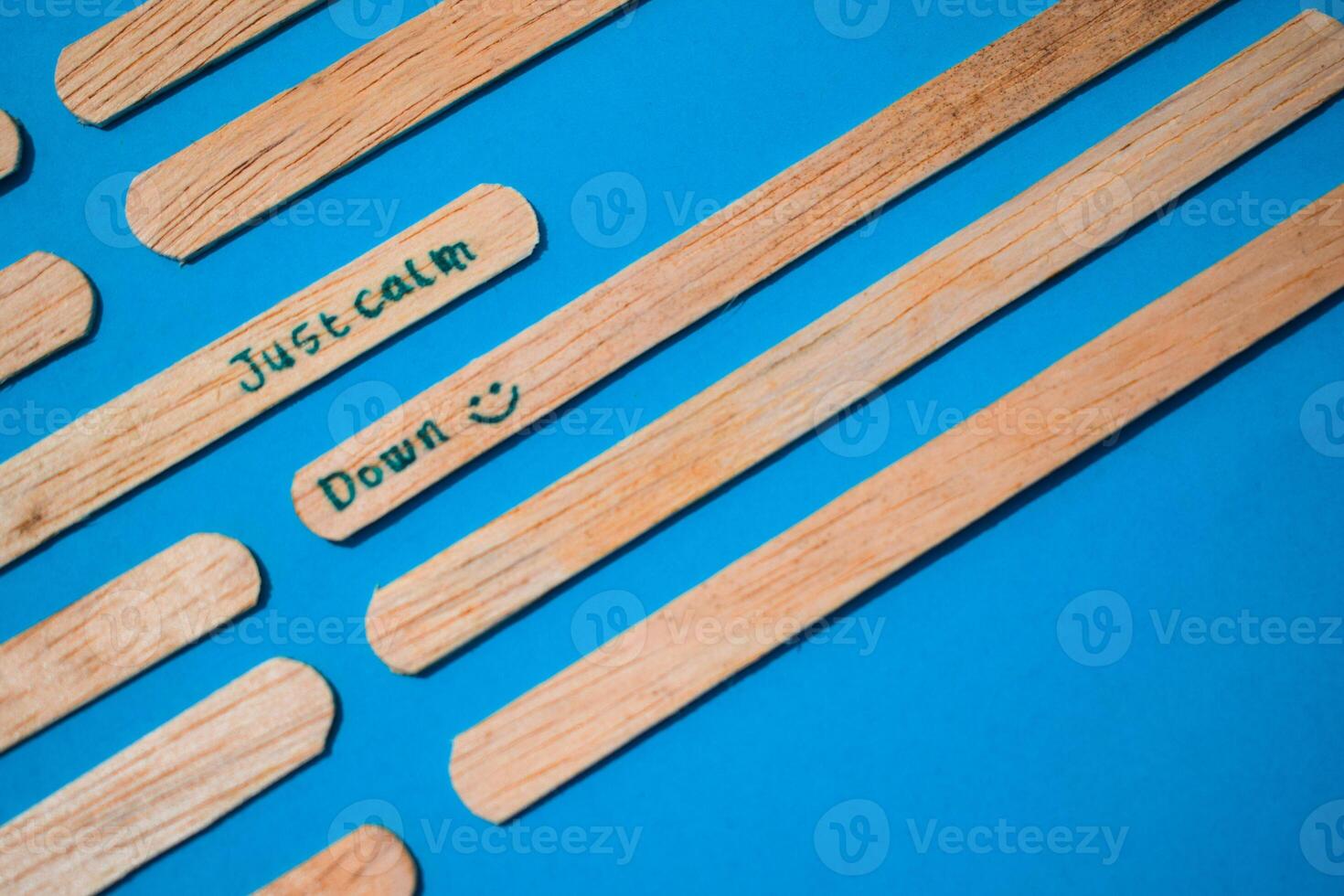 stick of ice cream with the words Just calm down. Motivational quotes, optimism, positive words. Isolated on background photo