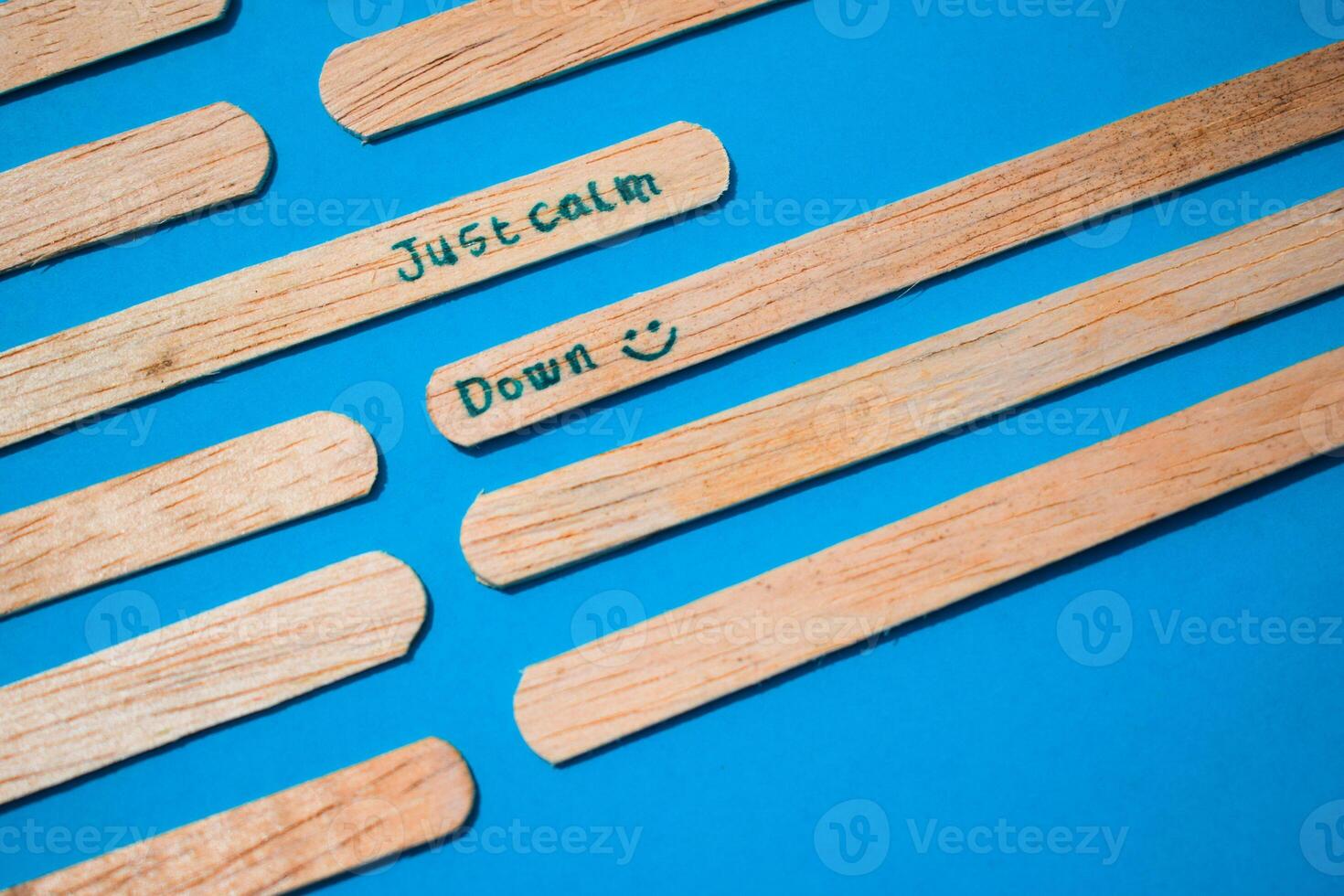 stick of ice cream with the words Just calm down. Motivational quotes, optimism, positive words. Isolated on background photo
