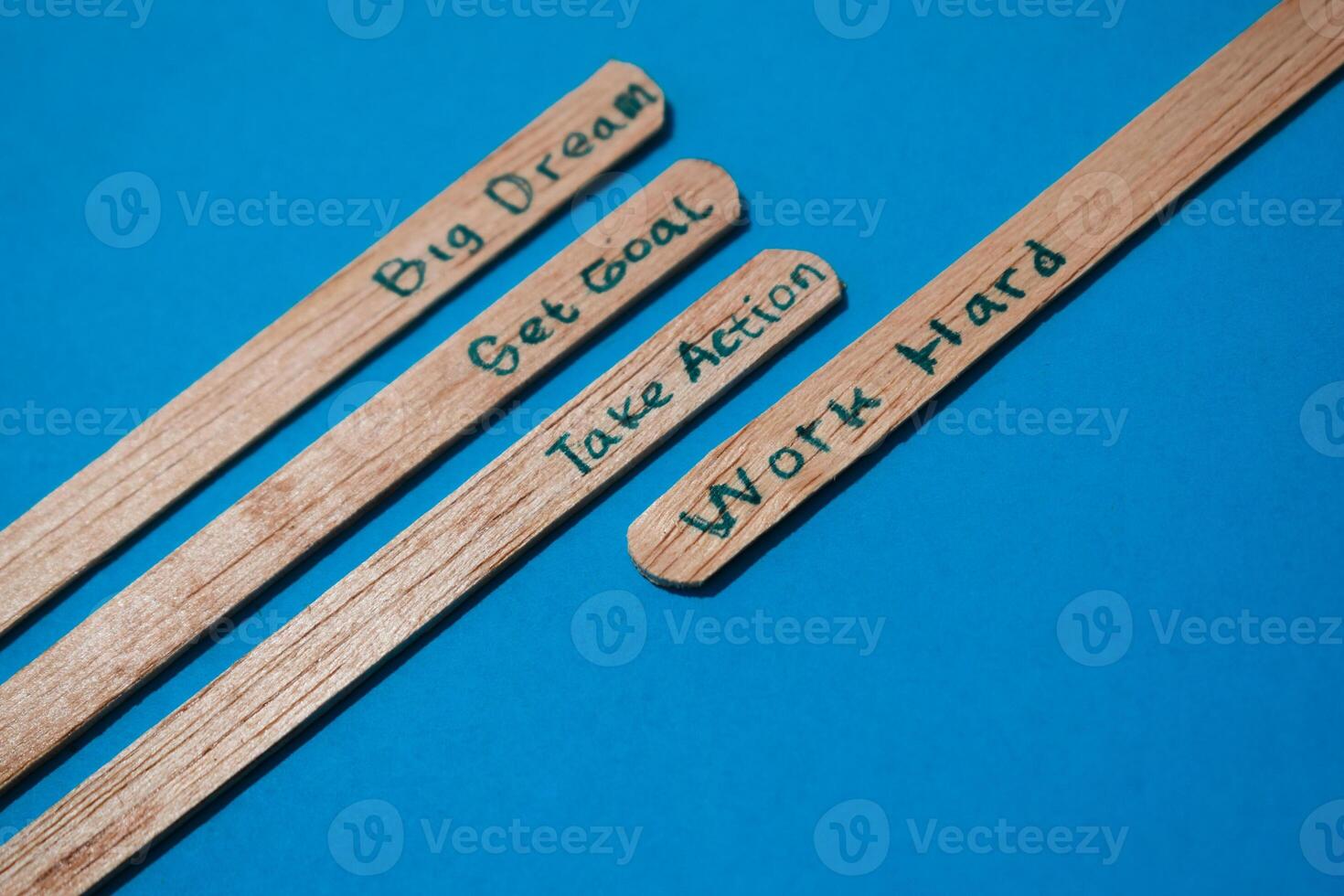 stick of ice cream with the words Big dream, Get goal, Take action, Work hard. Motivational quotes, optimism, positive words. Isolated on background photo