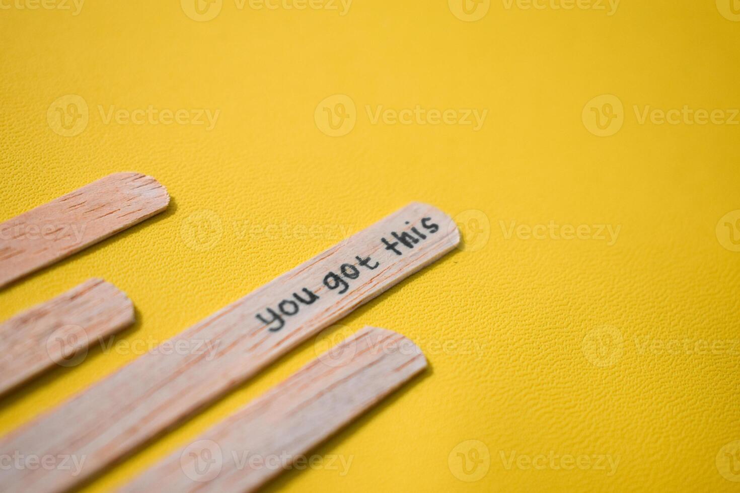 stick of ice cream with the words you got this. Motivational quotes, optimism, positive words. Isolated on background photo