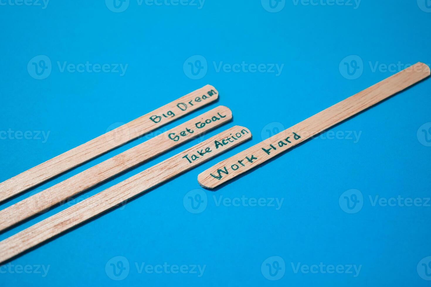 stick of ice cream with the words Big dream, Get goal, Take action, Work hard. Motivational quotes, optimism, positive words. Isolated on background photo