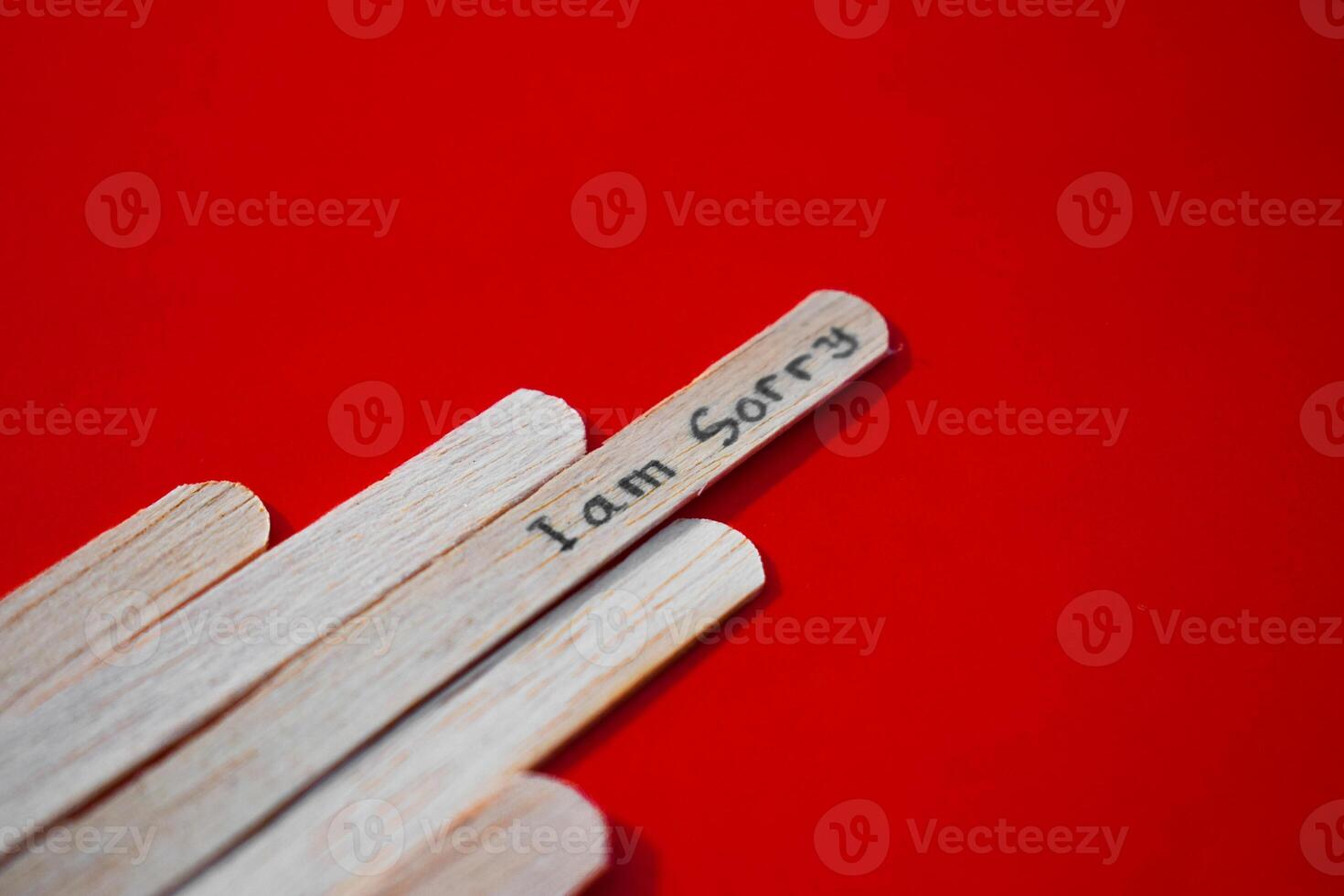 stick of ice cream with the words I am sorry. Motivational quotes, optimism, positive words. Isolated on background photo