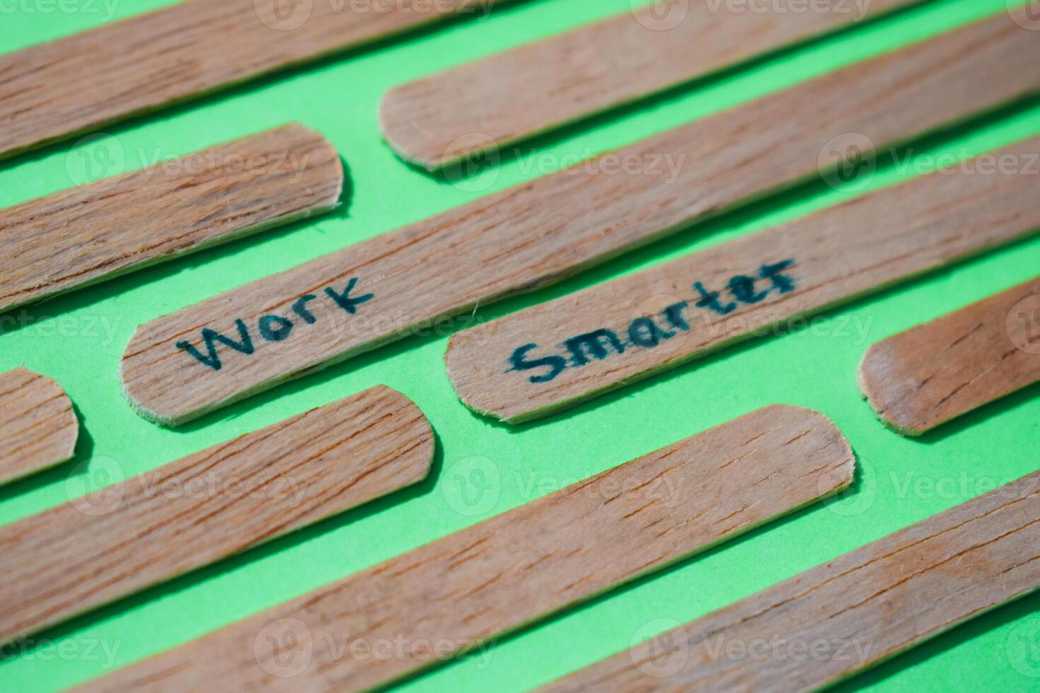 stick of ice cream with the words work smarter, motivational quotes, optimism, positive words. Isolated on background photo