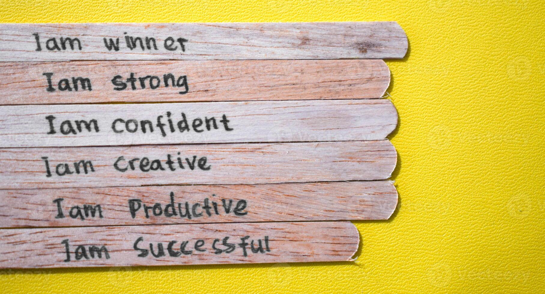 stick of ice cream with the words I am winner, strong, confident, creative, productive, successful. Motivational quotes, optimism, positive words photo