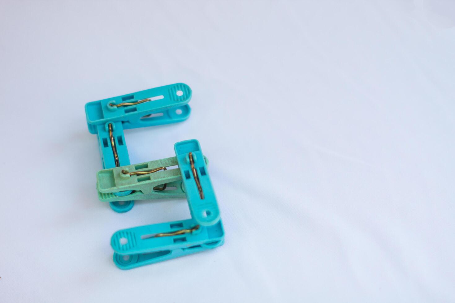 clothespin letter s photographed close up from a side angle with isolated background photo