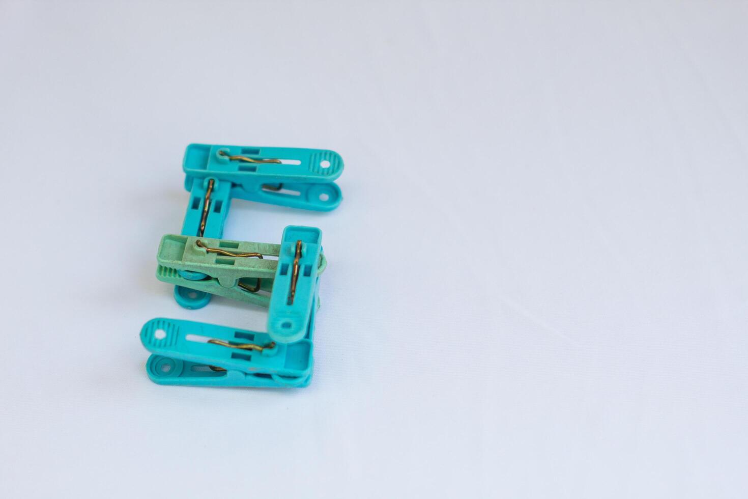 clothespin letter s photographed close up from a side angle with isolated background photo