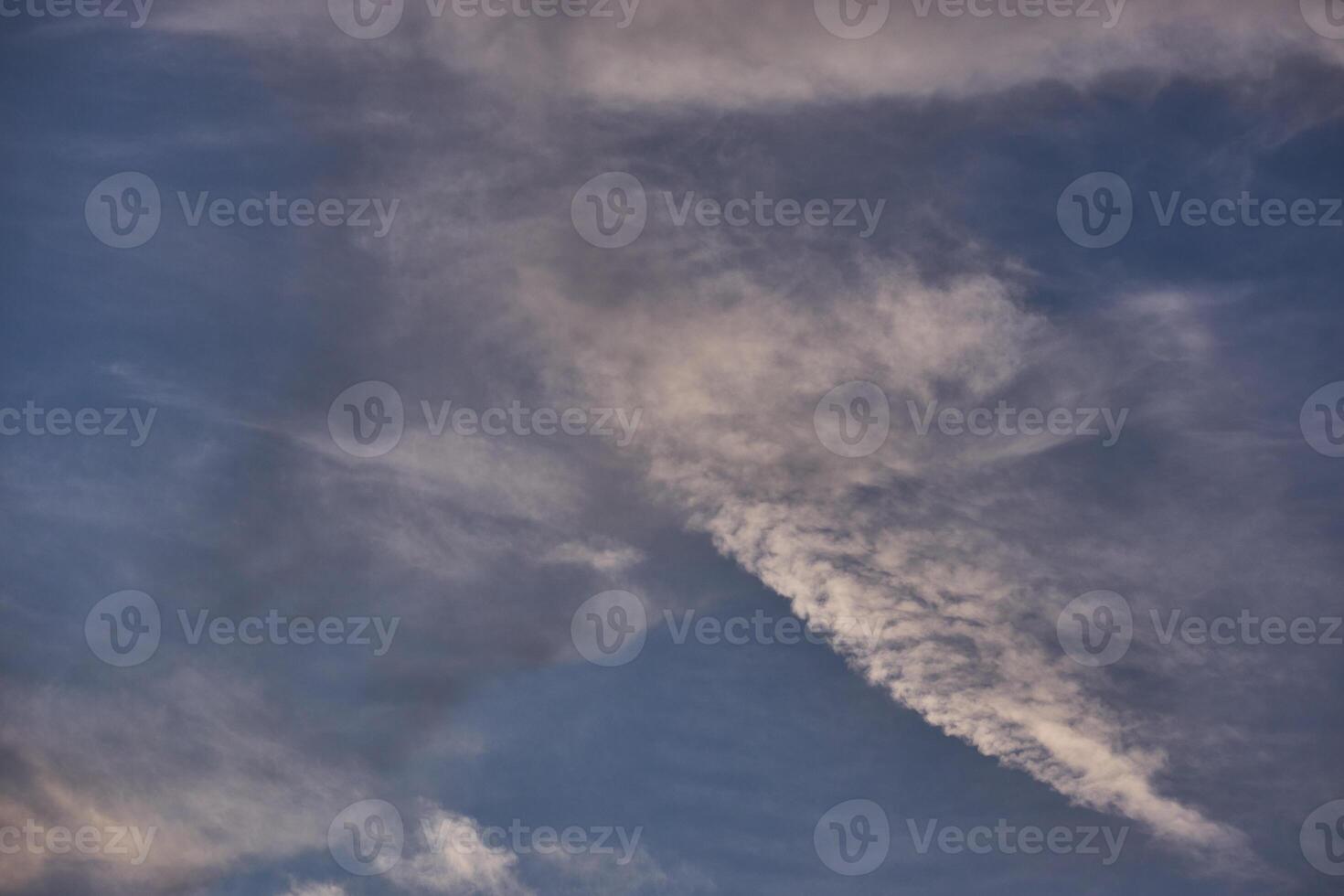 White clouds on blue sky background in the sunny afternoon photo