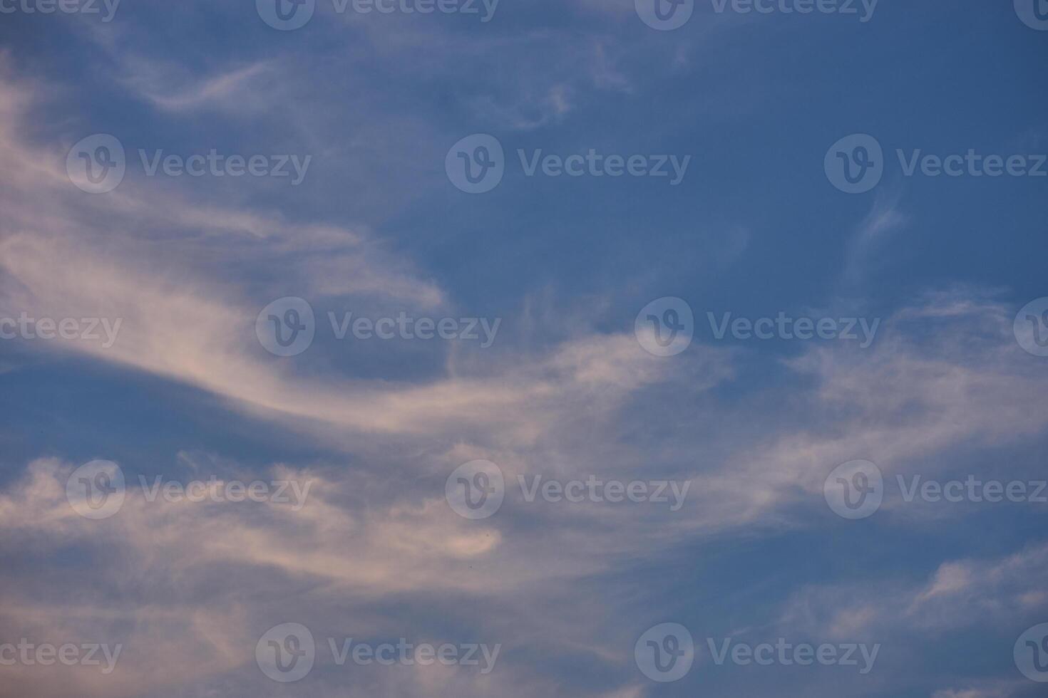 White clouds on blue sky background in the sunny afternoon photo