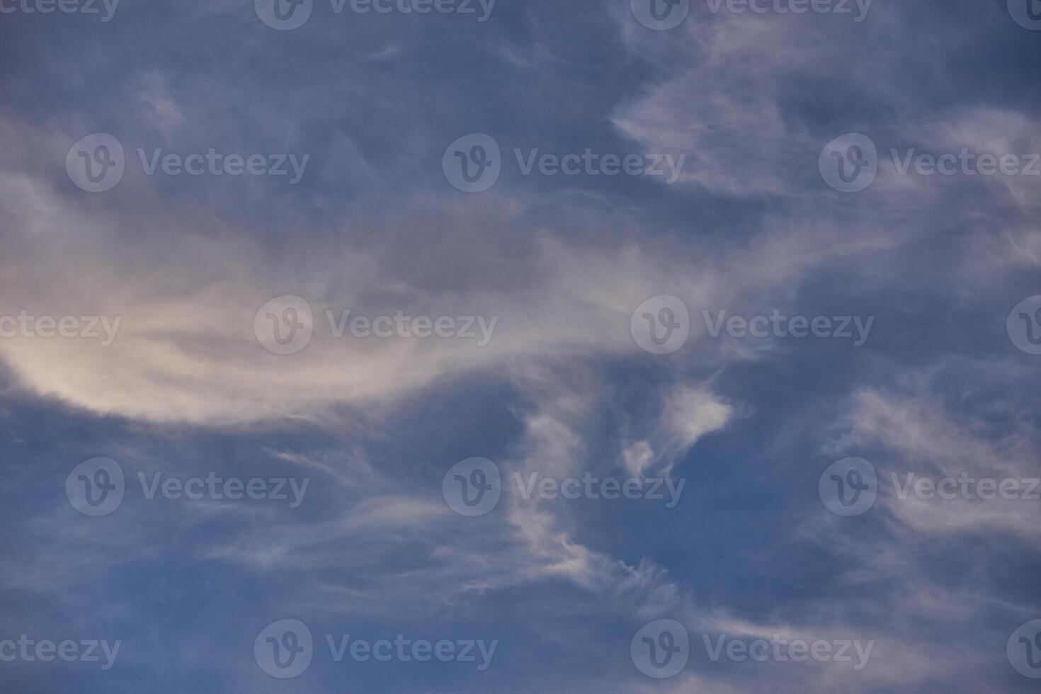 White clouds on blue sky background in the sunny afternoon photo