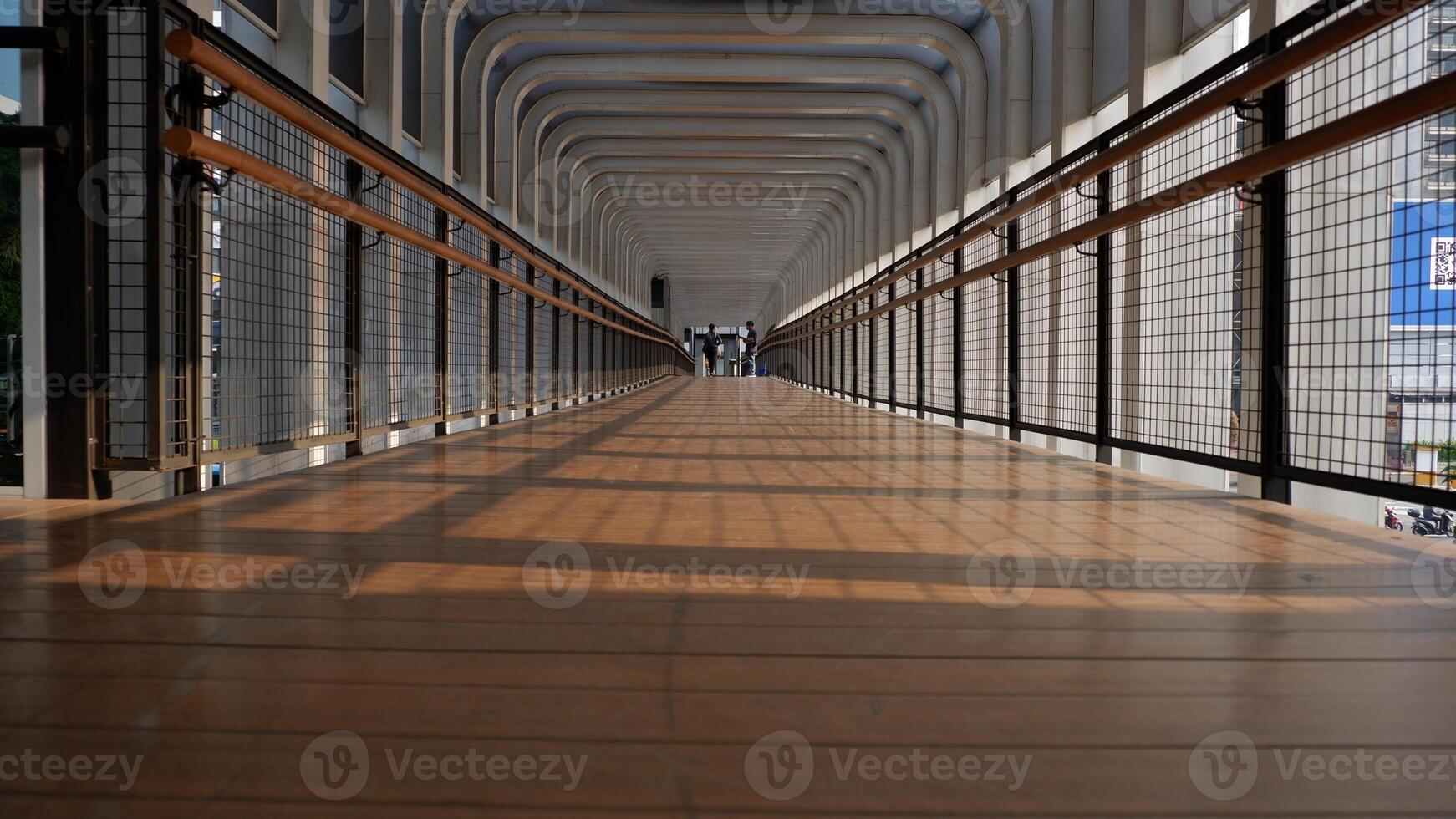 Low angle view of pedestrian bridge in the center of business and office in Jakarta photo