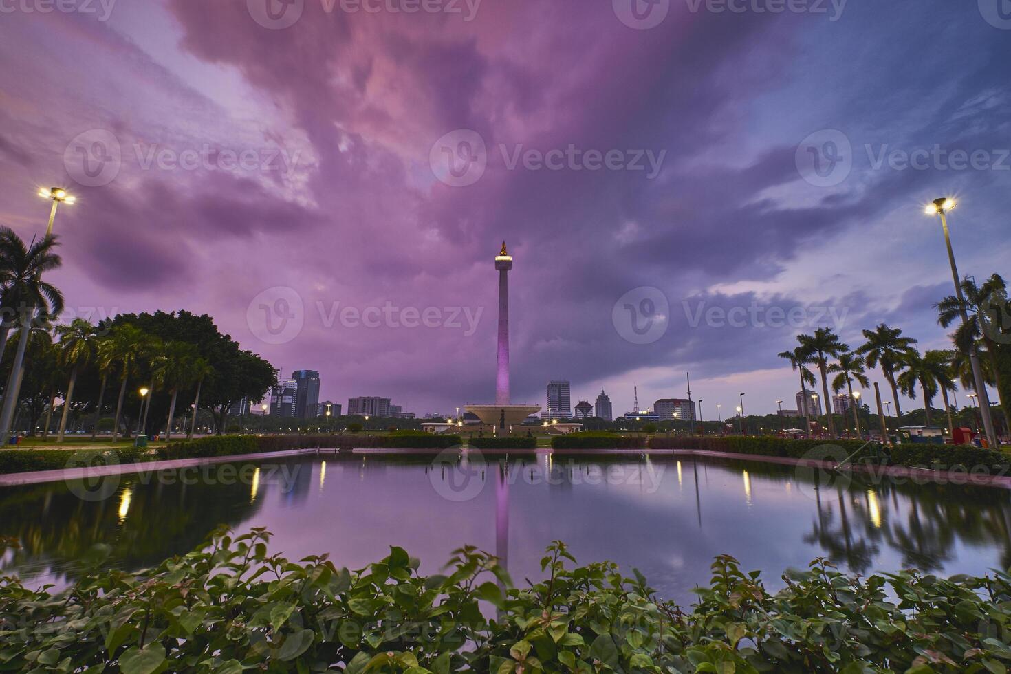 Beautiful sunset in National Monument Monas of Jakarta, Indonesia with dramatic colorful sky photo