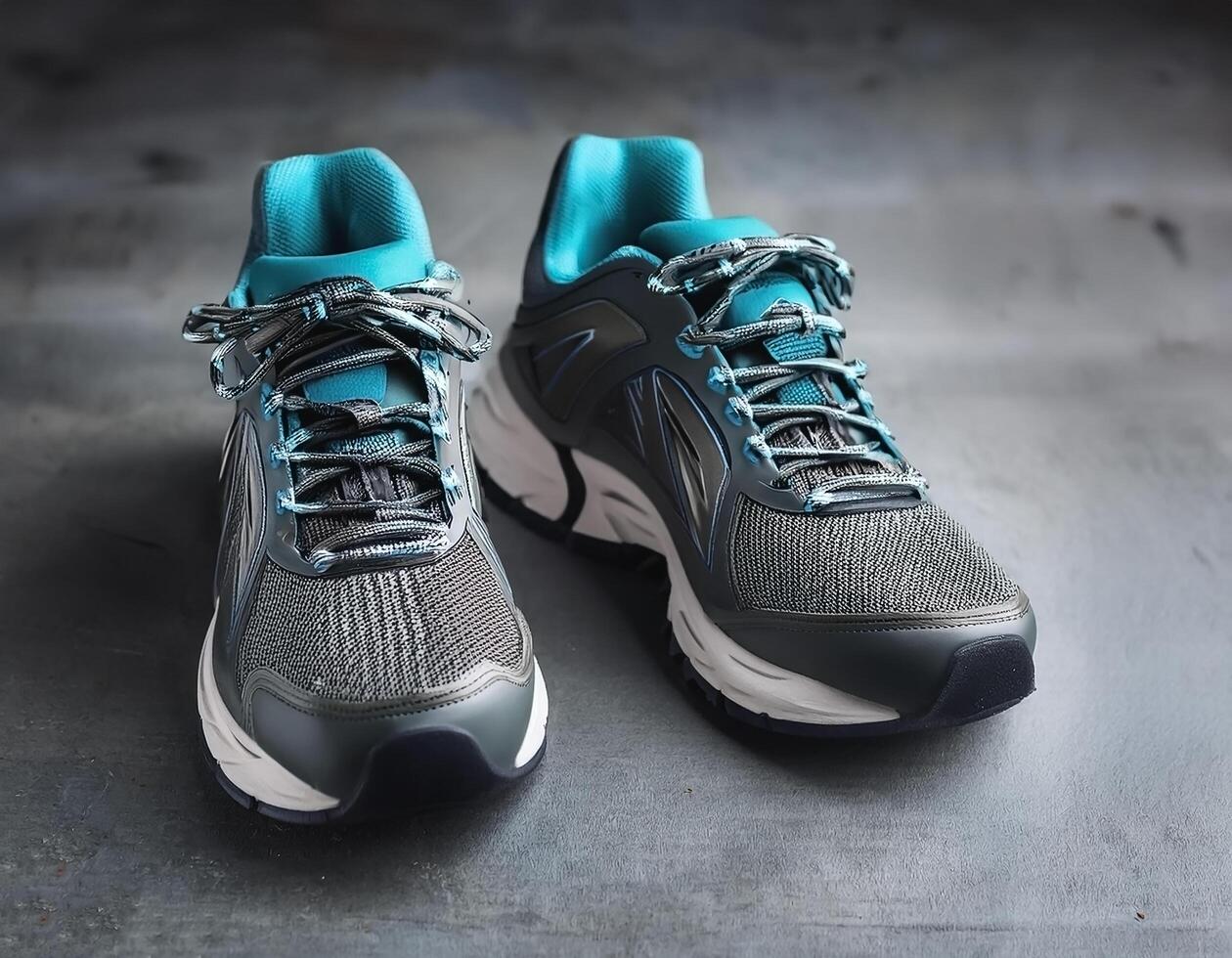 A pair of insulated running shoes on a concrete surface. Sports Shoes photo