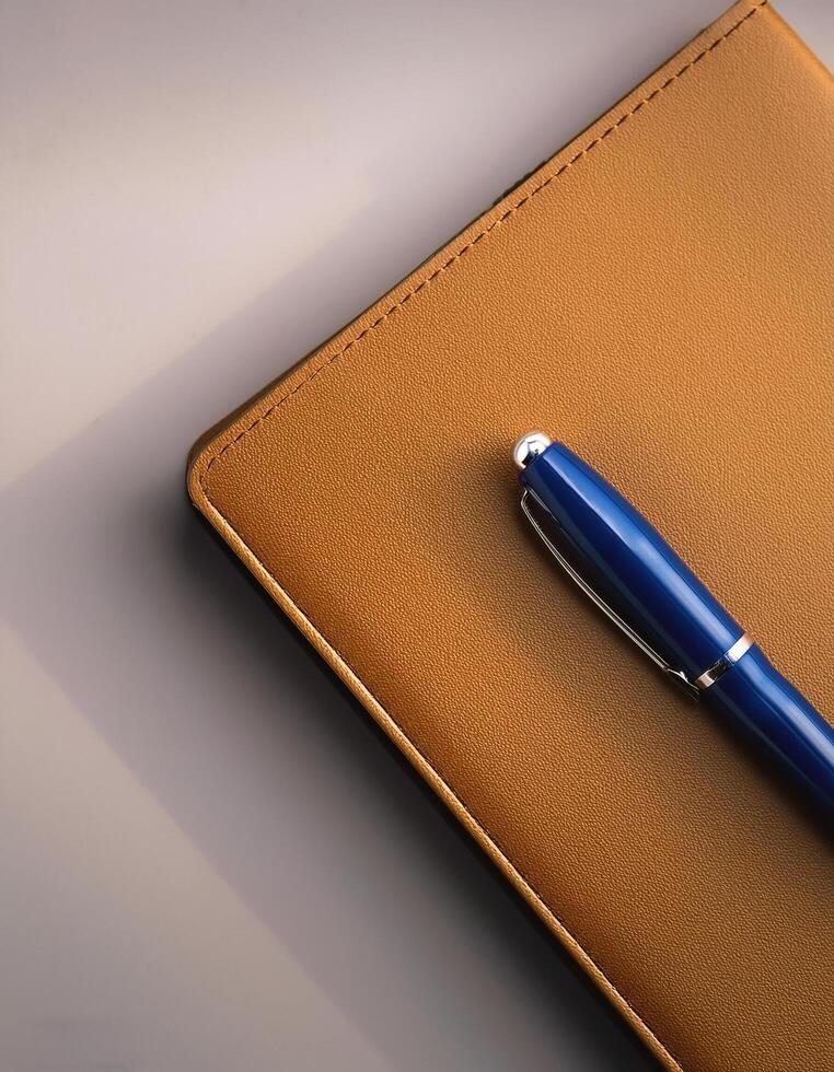 Pen and notebook isolated on minimalist background photo