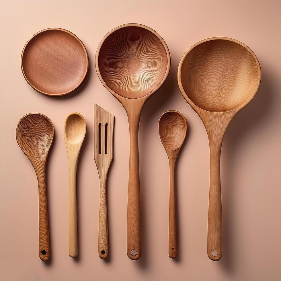 Wooden cooking utensils neatly isolated on minimalist background photo