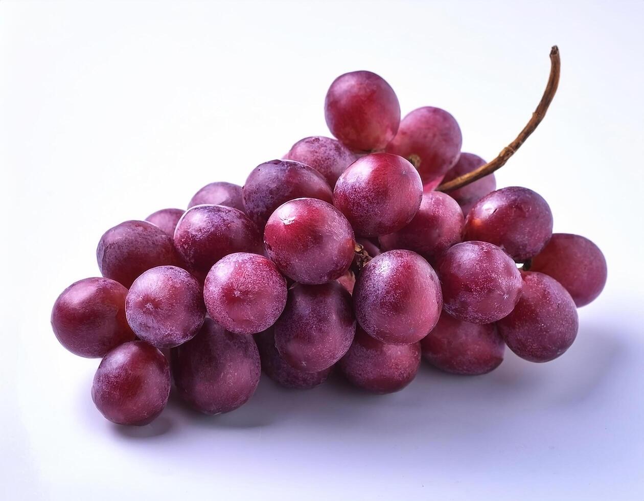 A bunch of purple grapes with one separate grain, focus on the skin texture isolated on white background photo