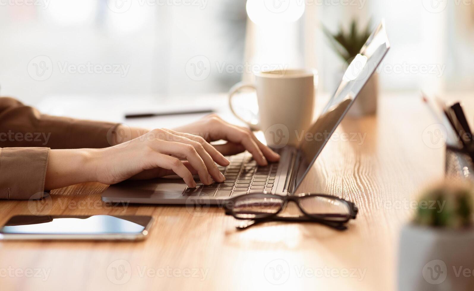 Doing Homework. Close up of teenager typing on laptop, browsing information, preparing project at home, empty space photo