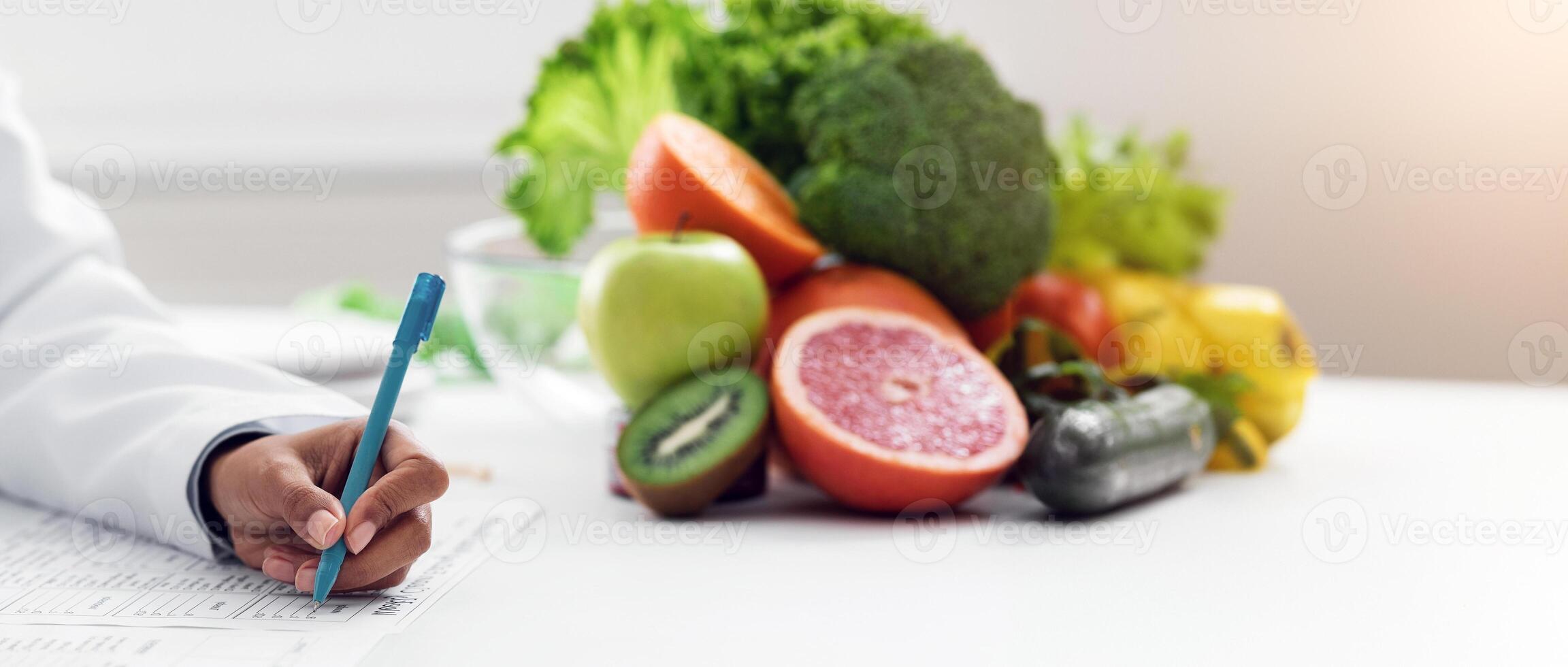 Cropped of afro woman nutritionist making treatment plan for patient at clinic, copy space photo