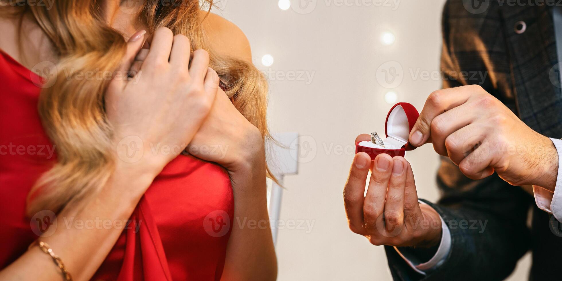 Surprise Proposal. Unrecognizable Man Giving Engagement Ring To His Girlfriend During Romantic Dinner In Restaurant, Asking To Marry Him, Crop photo