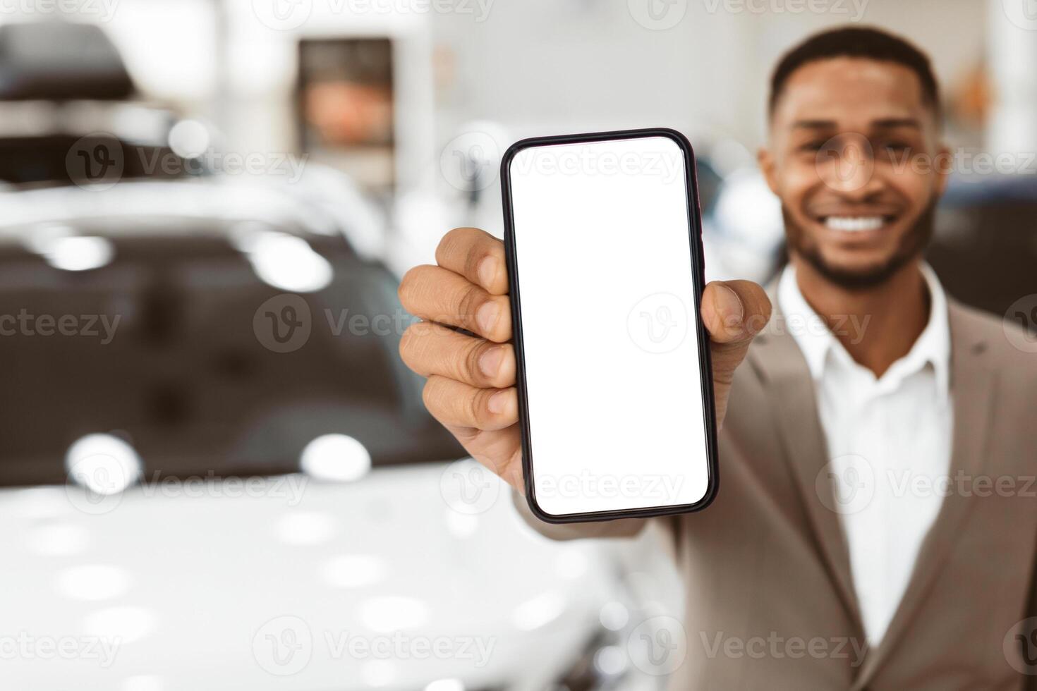 Car Rental. Unrecognizalble Agent Showing Auto Key Standing In Automobile Rental Office. Empty Space, Shallow Depth photo