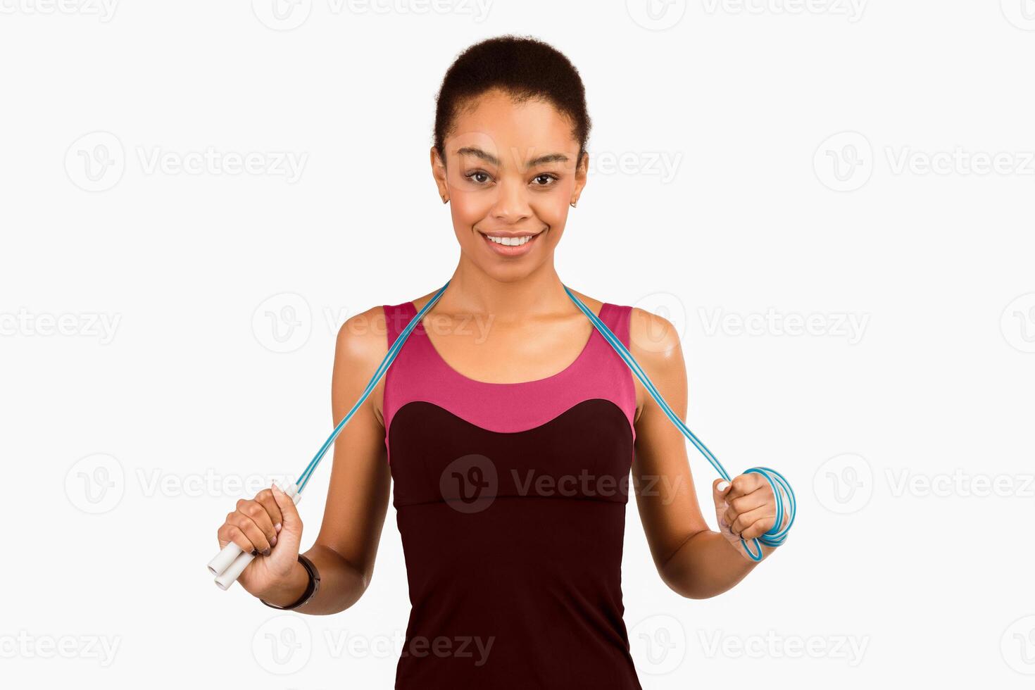 Fitness Workout. Smiling African American Woman Posing With Jump Rope Ready To Exercise Standing On White Background. Studio Shot photo
