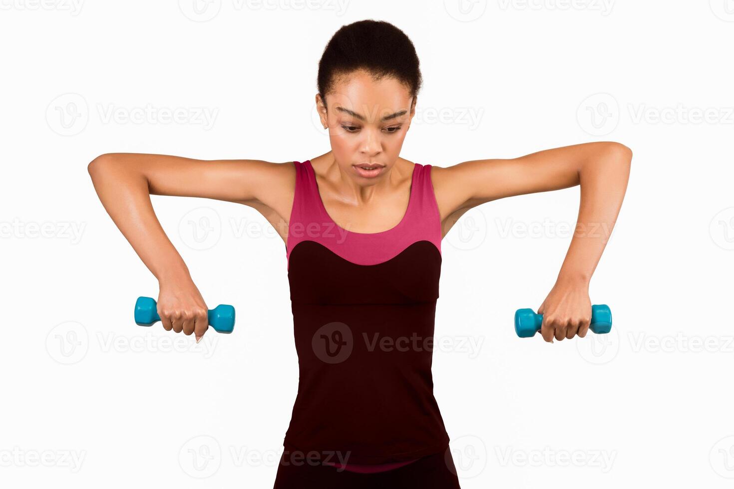 Dumbbells Strength Workout. Determined African American Girl Exercising Pumping Biceps Muscles Over White Studio Background photo