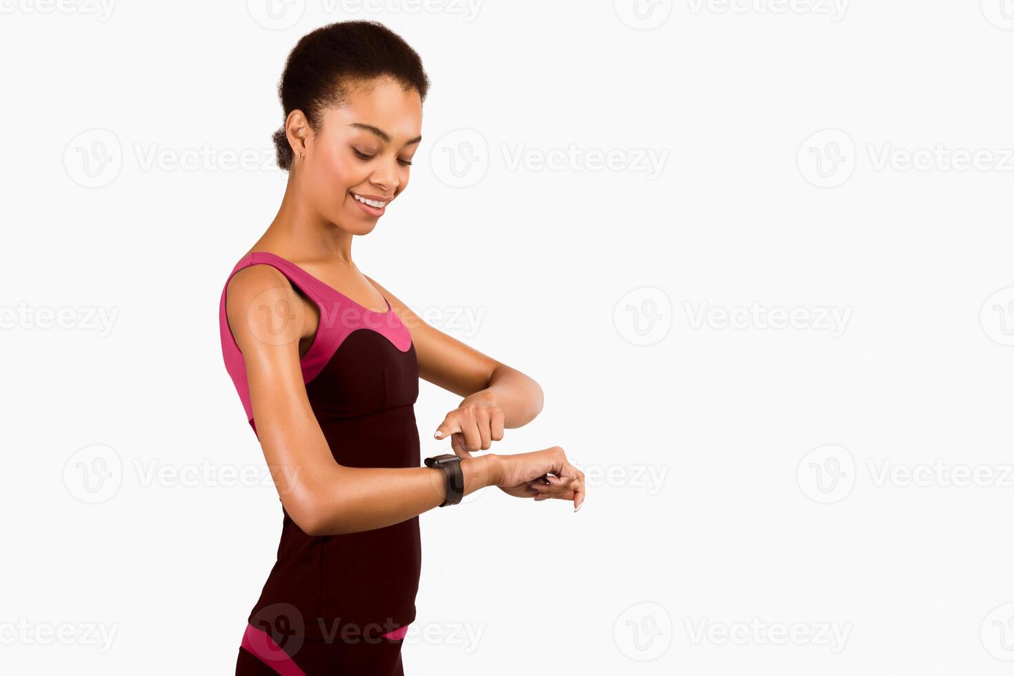 Fitness Gadgets. African American Girl Using Smartwatch During Workout Standing Over White Studio Background. Isolated, Free Space photo