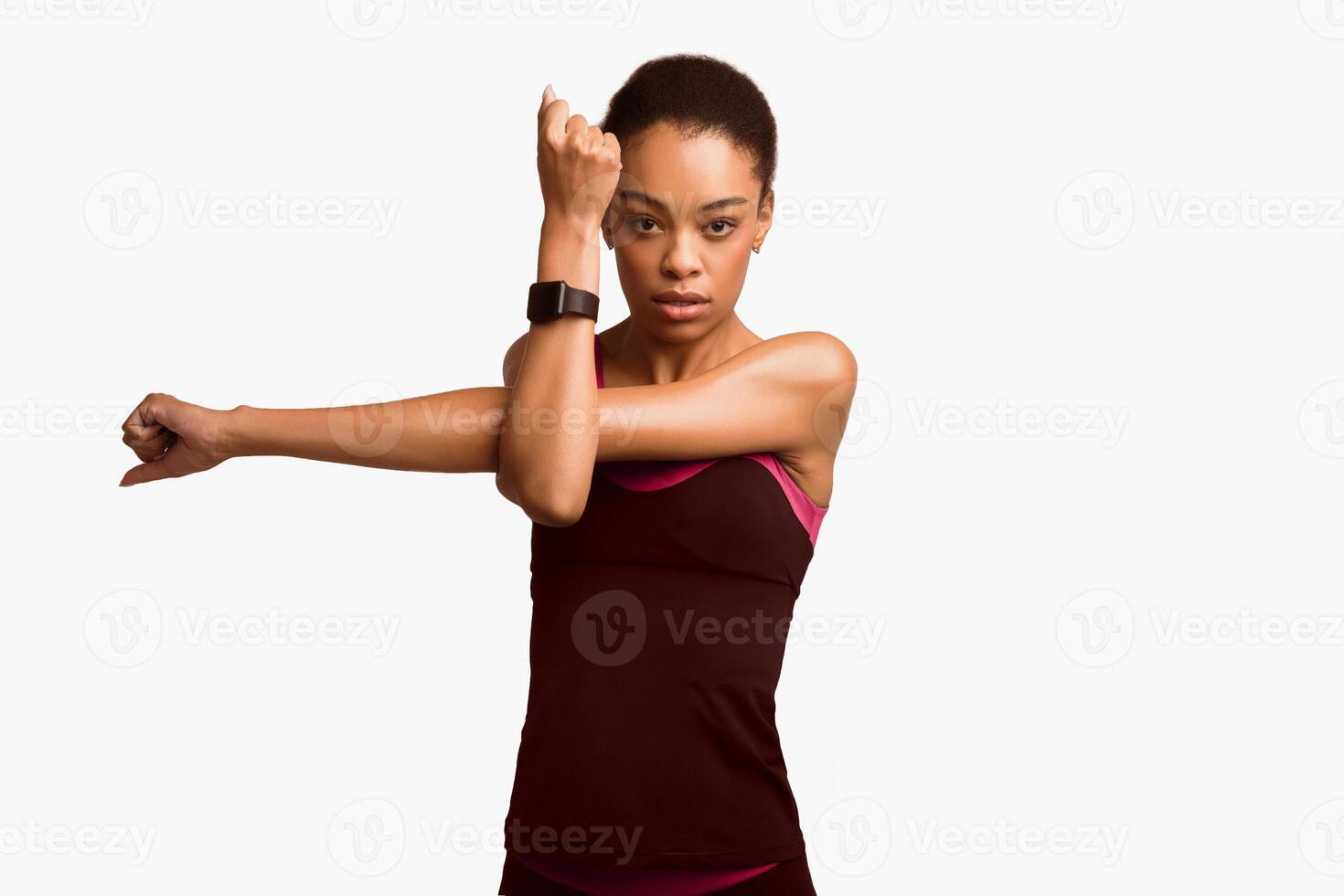 Workout Concept. Motivated African American Woman Doing Deltoid Arm Stretch Exercising Over White Background. Studio Shot photo