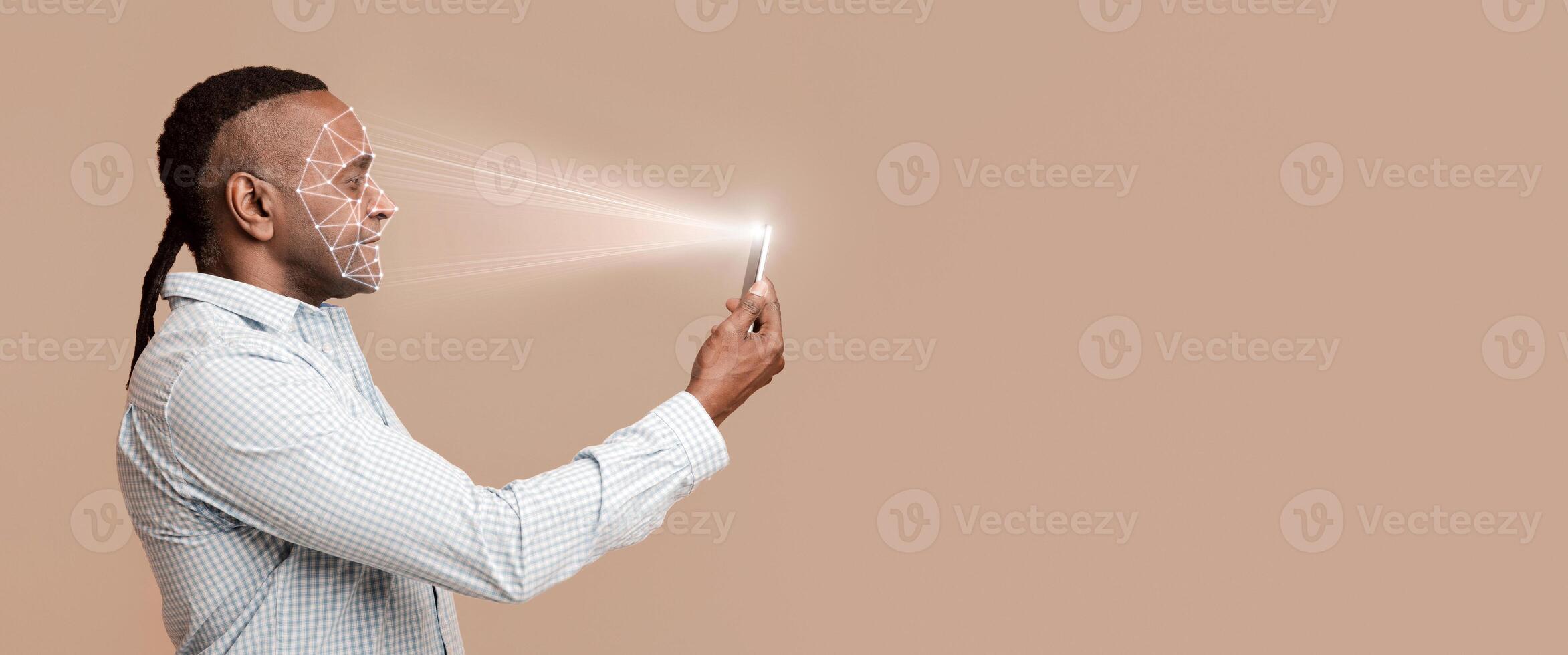 Facial recognition. Mature african man scanning his face with mobile app, free space photo