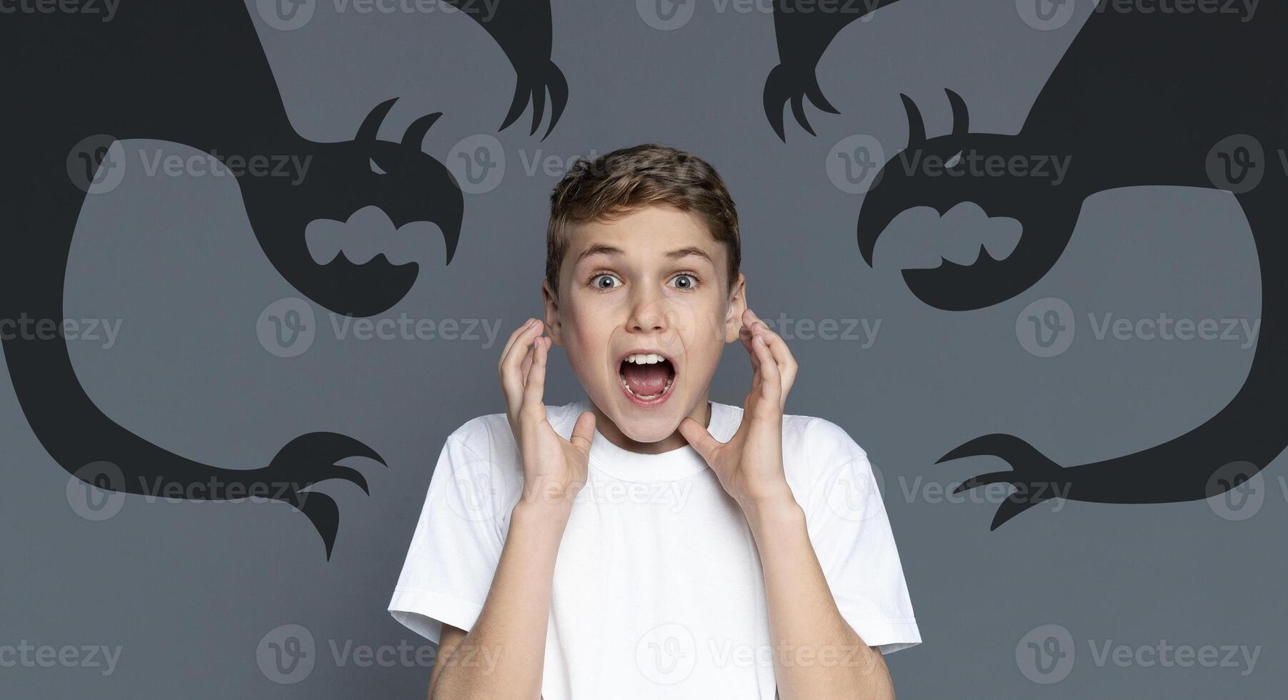 Screaming Teen Boy Scared Of Shadow Monsters Drawn Around Him, Creative Collage For Phobias And Inner Fears With Terrified Teenage Guy Shouting At Camera, Kid Suffering Nightmare, Panorama photo