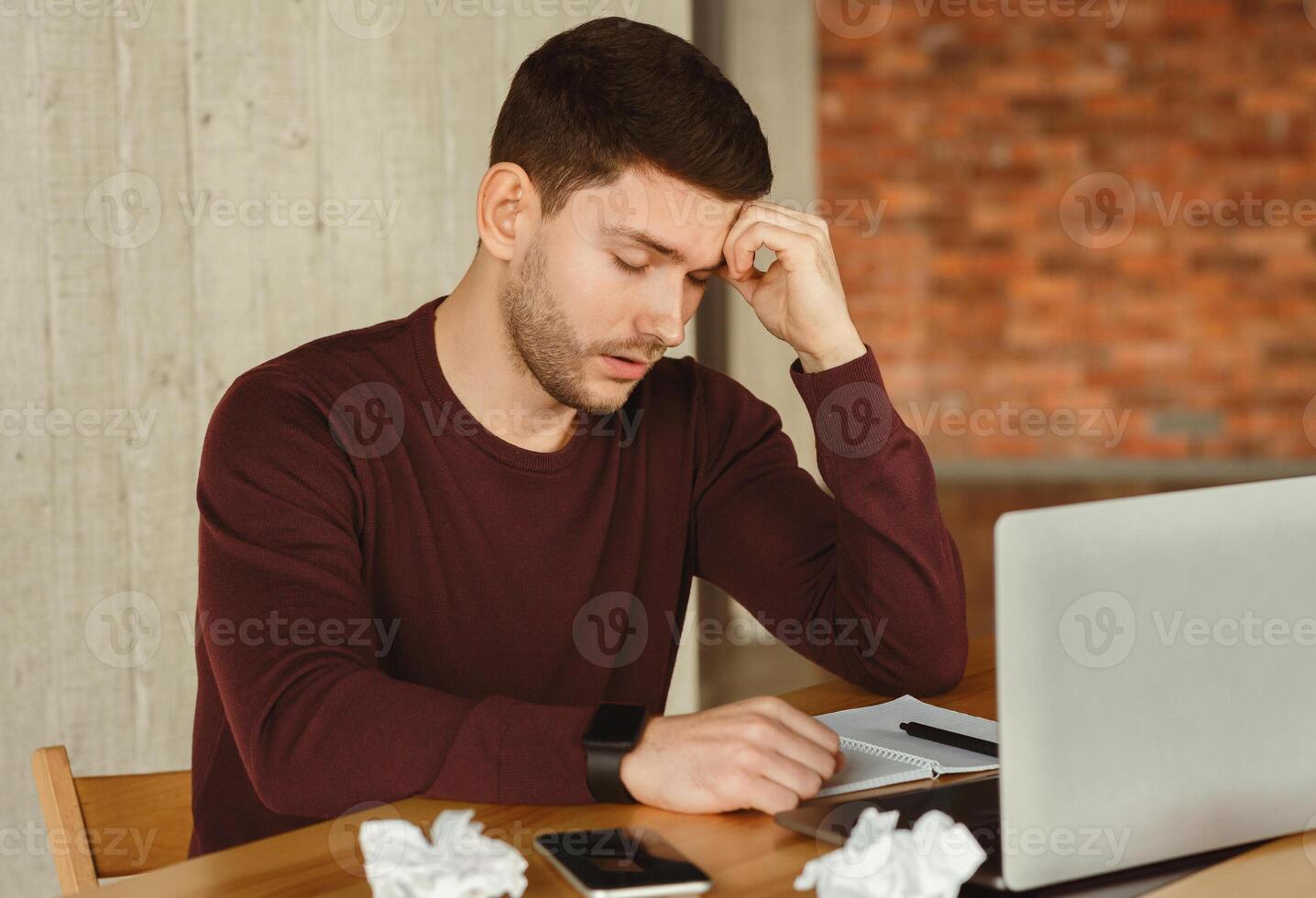 Tired Freelancer Guy Sleeping Sitting At Laptop In Modern Office. Nap At Work Concept. Selective Focus photo